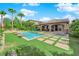 Beautiful backyard with a sparkling pool, spa, and lush green turf, ideal for outdoor living and entertaining at 2901 Josephine Dr, Henderson, NV 89044