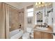 Bathroom featuring a shower/tub combo, toilet, sink and vanity with modern fixtures at 2901 Josephine Dr, Henderson, NV 89044