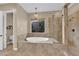 Luxurious bathroom featuring a soaking tub, separate shower, and modern fixtures at 2901 Josephine Dr, Henderson, NV 89044