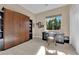 Spare bedroom with a built-in Murphy bed, desk, and neutral decor at 2901 Josephine Dr, Henderson, NV 89044