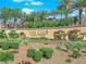 Elegant community entrance featuring lush landscaping and a welcoming gatehouse at 2901 Josephine Dr, Henderson, NV 89044