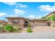 Beautiful home exterior with manicured landscaping, stone accents, and a convenient three-car garage at 2901 Josephine Dr, Henderson, NV 89044