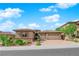Beautiful single-story home showcasing lush landscaping, a paver driveway, and an attached two-car garage at 2901 Josephine Dr, Henderson, NV 89044