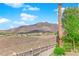 Scenic view of a luxury home nestled in the desert landscape with mountains in the backdrop at 2901 Josephine Dr, Henderson, NV 89044