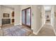 Inviting foyer with decorative double doors, tile flooring, and neutral color scheme at 2901 Josephine Dr, Henderson, NV 89044