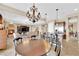 Open-concept kitchen and living space with fireplace and stainless steel appliances at 2901 Josephine Dr, Henderson, NV 89044