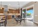 Well-equipped kitchen with dining area and sliding glass doors to outdoor pool at 2901 Josephine Dr, Henderson, NV 89044