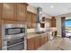 Gourmet kitchen with stainless steel appliances and tile backsplash at 2901 Josephine Dr, Henderson, NV 89044