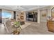 Spacious living room with fireplace, TV cabinet, tile floors and comfortable seating area at 2901 Josephine Dr, Henderson, NV 89044