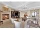Elegant living room featuring a fireplace, TV cabinet, and neutral decor at 2901 Josephine Dr, Henderson, NV 89044