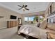 Comfortable main bedroom with large windows, a ceiling fan, and stylish decor at 2901 Josephine Dr, Henderson, NV 89044
