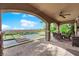Elegant covered patio with a dining set, offering a view of the pool and landscaped backyard at 2901 Josephine Dr, Henderson, NV 89044