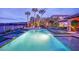Inviting backyard pool with palm trees and serene landscape, perfect for relaxation and entertaining at 2901 Josephine Dr, Henderson, NV 89044