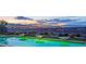 Inviting pool with water features offers a serene escape with city views, complemented by manicured landscaping at 2901 Josephine Dr, Henderson, NV 89044