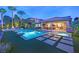 Stunning backyard pool with a spa, covered patio, and lush landscaping, perfect for outdoor relaxation and entertainment at 2901 Josephine Dr, Henderson, NV 89044