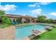 Stunning pool with water features and lush greenery creates a private retreat at 2901 Josephine Dr, Henderson, NV 89044