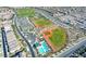 Aerial view of community recreation fields, ball fields, swimming pool and neighborhood at 3163 Biccari Ave, Henderson, NV 89044