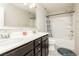 Bathroom featuring a double sink vanity, large mirror, and tub with shower at 3163 Biccari Ave, Henderson, NV 89044