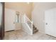 Bright foyer with tile flooring, staircase, and convenient access to front door and rooms at 3163 Biccari Ave, Henderson, NV 89044