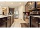 This well-equipped kitchen offers stainless appliances, dark cabinets, and sleek countertops at 3163 Biccari Ave, Henderson, NV 89044