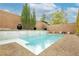 Backyard pool and spa with mature landscaping and brick privacy wall at 3163 Biccari Ave, Henderson, NV 89044