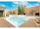 Backyard pool and spa with mature landscaping and brick privacy wall at 3163 Biccari Ave, Henderson, NV 89044