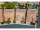 Aerial view of a home with a well-maintained roof, backyard landscaping and neighborhood at 3278 Turning Bridge St, Las Vegas, NV 89135