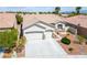 Charming single-story home featuring a two-car garage and well-manicured landscaping at 3278 Turning Bridge St, Las Vegas, NV 89135