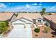 Well-maintained single-story home with desert landscaping, a two-car garage, and a tile roof at 3278 Turning Bridge St, Las Vegas, NV 89135