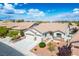 Beautiful home featuring a two-car garage and tasteful landscaping in a desert community at 3278 Turning Bridge St, Las Vegas, NV 89135