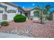 Inviting front yard featuring low-maintenance desert landscaping and a lush green bush at 3278 Turning Bridge St, Las Vegas, NV 89135