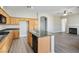 Well-designed kitchen with granite countertops, and stainless steel appliances seamlessly connects to the living area at 3278 Turning Bridge St, Las Vegas, NV 89135