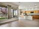 Bright and airy living room featuring large windows overlooking the backyard and open kitchen layout at 3278 Turning Bridge St, Las Vegas, NV 89135