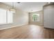 Spacious living room with wood flooring, shutters, and natural light at 3278 Turning Bridge St, Las Vegas, NV 89135