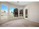 Bright living room featuring large windows offering beautiful views of the outdoors and letting in natural light at 3278 Turning Bridge St, Las Vegas, NV 89135