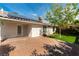 This backyard has a brick paver patio, artificial grass, and solar panels at 3510 Judah Way, Las Vegas, NV 89147
