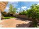 Backyard features a brick paver patio, artificial grass and mature landscaping at 3510 Judah Way, Las Vegas, NV 89147