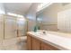 Bathroom showcasing vanity with large mirror and shower with gold trim at 3510 Judah Way, Las Vegas, NV 89147