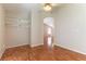 Bedroom with arched entryway and light hardwood floors at 3510 Judah Way, Las Vegas, NV 89147