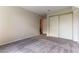Carpeted bedroom with closet and doorway at 3510 Judah Way, Las Vegas, NV 89147