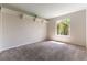 Bedroom featuring neutral carpet, shelf, and a bright window at 3510 Judah Way, Las Vegas, NV 89147