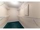 A large walk-in closet with wire shelving and teal carpeting adds storage to the space at 3510 Judah Way, Las Vegas, NV 89147