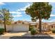Charming home with solar panels and a well-maintained front yard with mature trees at 3510 Judah Way, Las Vegas, NV 89147