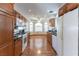 Well-lit kitchen features wood cabinets, granite countertops, and modern stainless steel appliances at 3510 Judah Way, Las Vegas, NV 89147