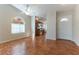 Bright living room with hardwood floors and arch windows that let in natural light at 3510 Judah Way, Las Vegas, NV 89147