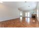 Spacious living room with hardwood floors, a fireplace, and neutral-toned walls at 3510 Judah Way, Las Vegas, NV 89147