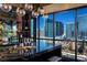 Modern bar area featuring a marble counter, city views, and ample bar stool seating at 4575 Dean Martin Dr # 1909, Las Vegas, NV 89103