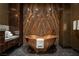 Copper soaking tub complements the marble countertops and backsplash in this upscale bathroom at 4575 Dean Martin Dr # 1909, Las Vegas, NV 89103