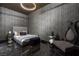 Modern bedroom with elegant chandelier, marble floors, and unique accent furniture at 4575 Dean Martin Dr # 1909, Las Vegas, NV 89103