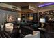 Open concept living space with modern decor, plush seating, ambient lighting, and a stylish kitchen bar at 4575 Dean Martin Dr # 1909, Las Vegas, NV 89103